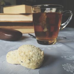 Tea cup and cookie on table