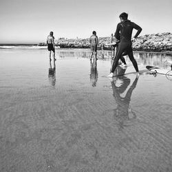 Full length of woman standing on beach