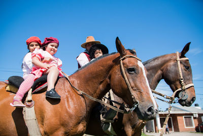 South american family riding horses