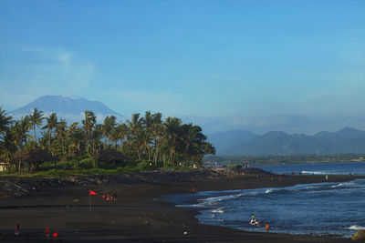 Scenic view of mount agung and bali beach against sky