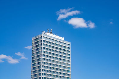 Low angle view of building against blue sky