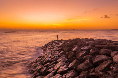 Scenic view of sea against sky during sunset