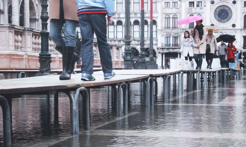 Low section of people standing on water