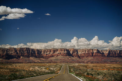 Panoramic view of country road against sky