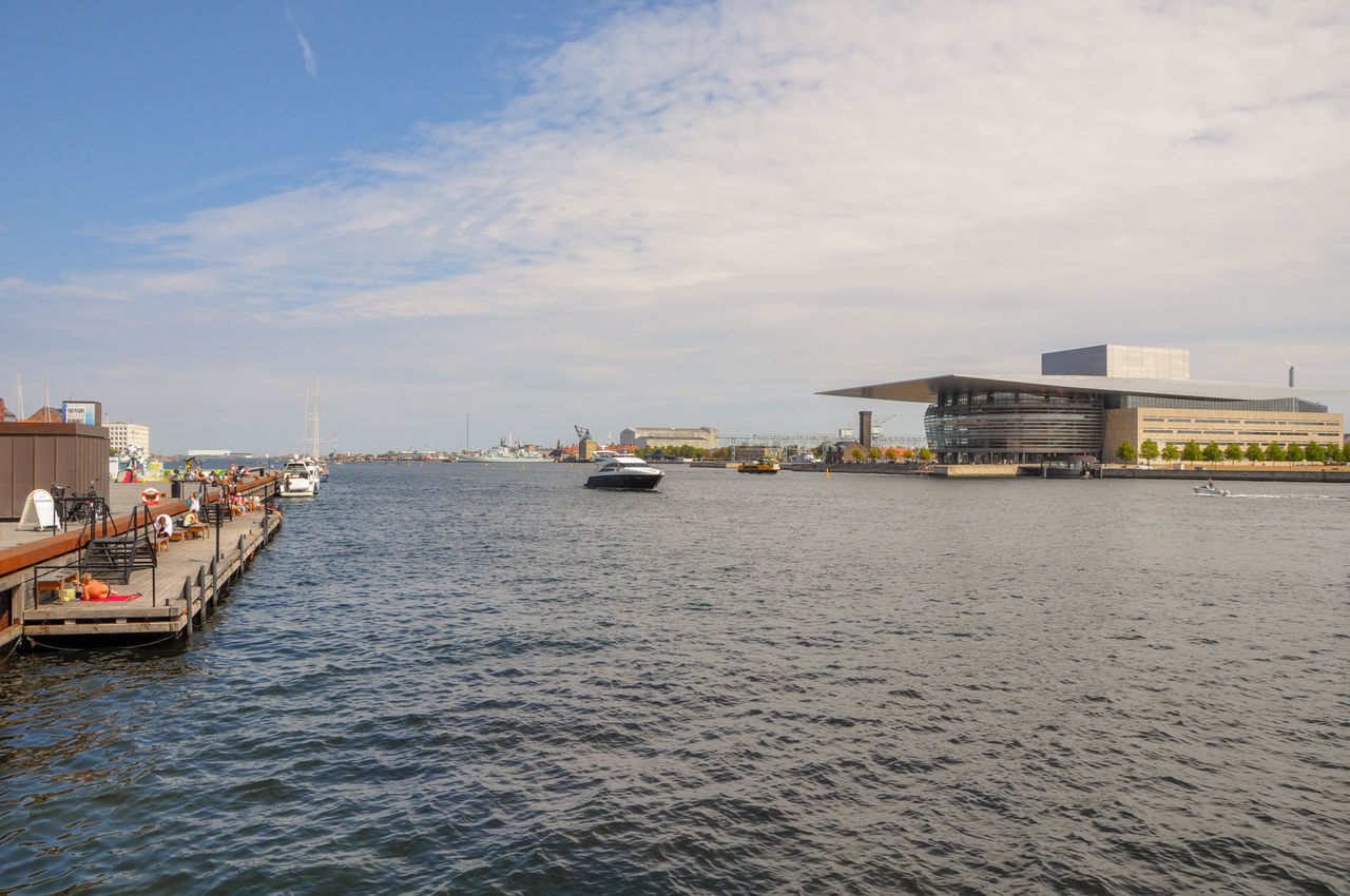 water, sky, waterfront, architecture, built structure, building exterior, cloud - sky, nautical vessel, transportation, sea, nature, mode of transportation, city, building, freight transportation, no people, ship, shipping, outdoors, passenger craft