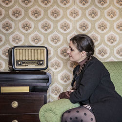 Woman sitting on sofa