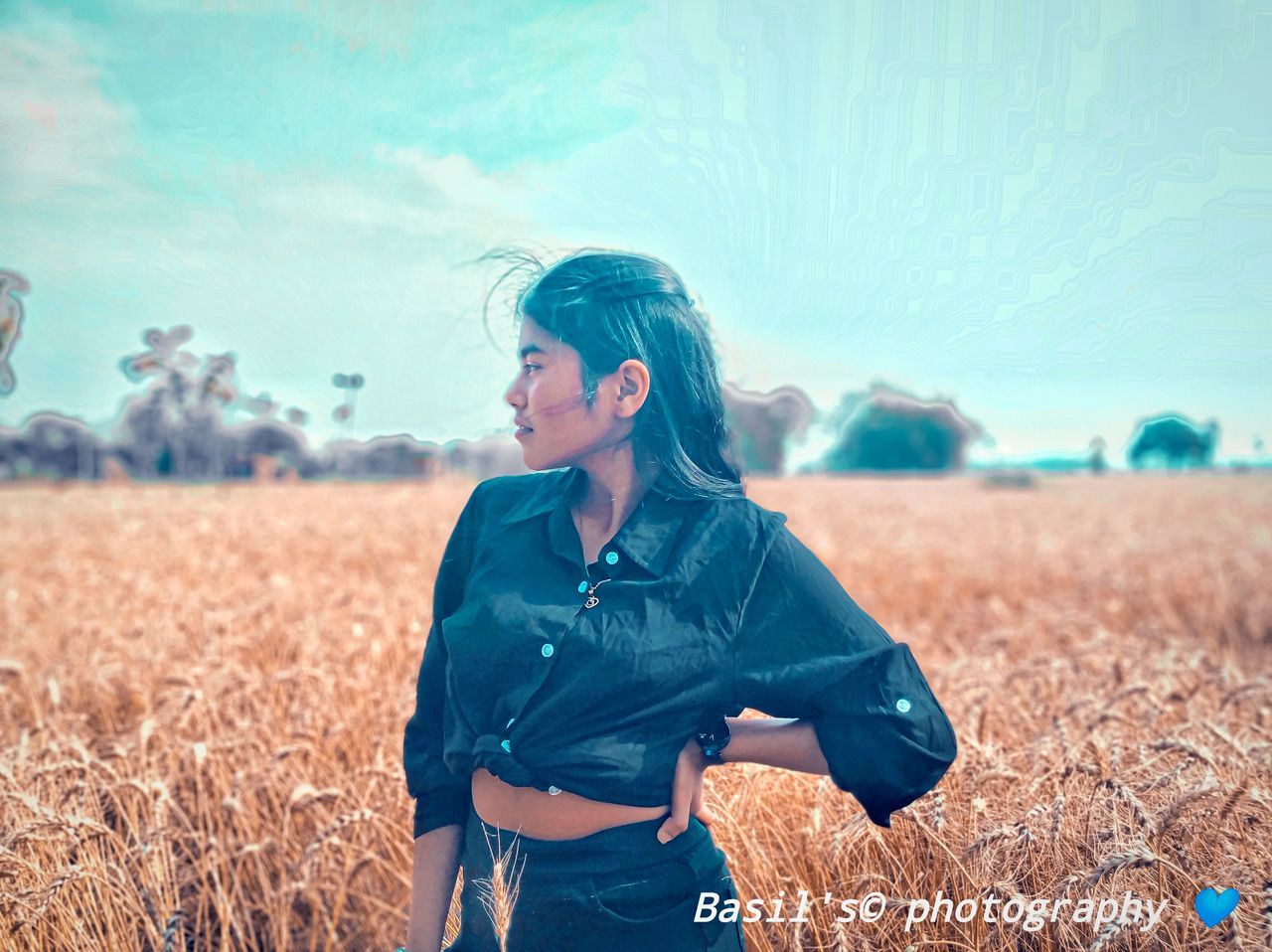 field, land, one person, real people, standing, agriculture, three quarter length, lifestyles, leisure activity, sky, young adult, nature, young women, casual clothing, adult, environment, day, landscape, farm, outdoors, hairstyle