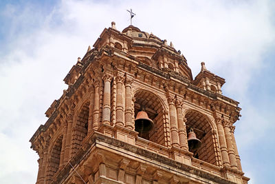 Baroque bell tower of the basilica menor de la merced on plaza de armas square, cusco city, peru