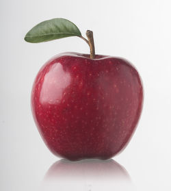 Close-up of apple against white background