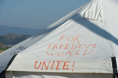 Text on roof of refugee camp