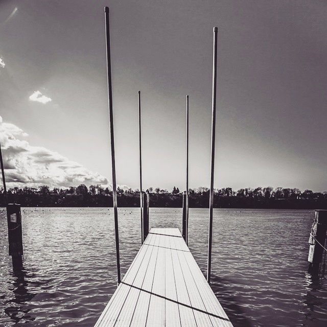 water, sky, pier, built structure, the way forward, sea, transportation, railing, river, jetty, architecture, rippled, waterfront, nature, tranquility, tranquil scene, outdoors, nautical vessel, no people, diminishing perspective