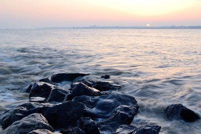 Scenic view of sea at sunset