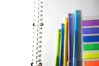 Close-up of colored pencils against white background