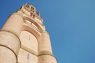 Low angle view of historical building against blue sky