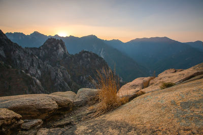 Scenic view of mountains against sky during sunset