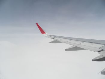 Low angle view of airplane flying in sky