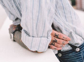 Midsection of woman with hands