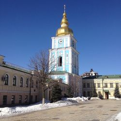 Low angle view of building against clear blue sky