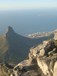 High angle view of rocks by sea against sky