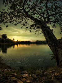 Scenic view of lake against sky during sunset