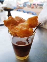 Close-up of coffee in glass on table