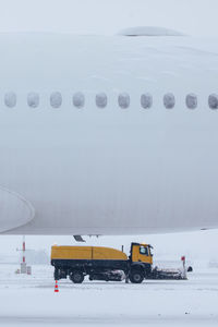 Winter frosty day at airport during heavy snowfall. 