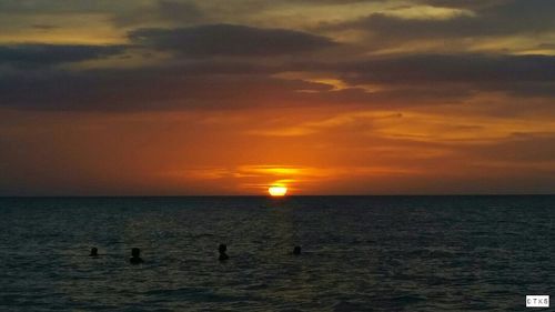 Scenic view of sea at sunset