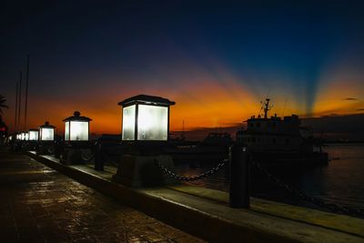 View of illuminated city at sunset