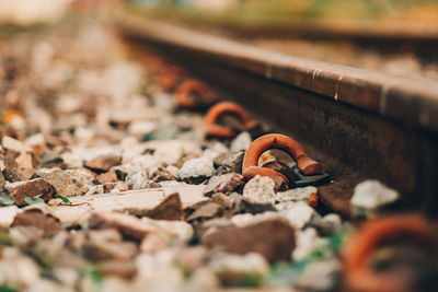 Close-up of cigarette on railroad track