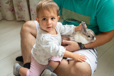 Portrait of cute baby girl sitting