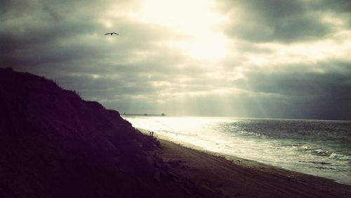 Scenic view of sea against cloudy sky