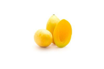 Close-up of oranges against white background