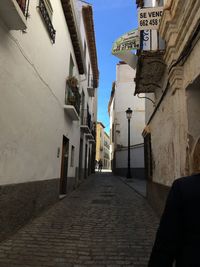 Narrow alley amidst buildings in city