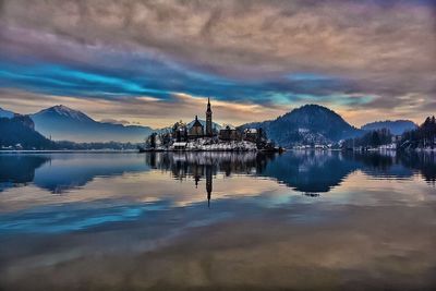 Reflection of clouds in lake at dusk