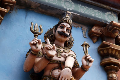 Low angle view of statues against building