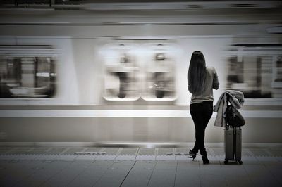 Woman waiting at railway station platform