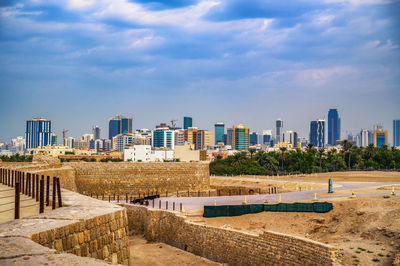 Buildings in city against sky