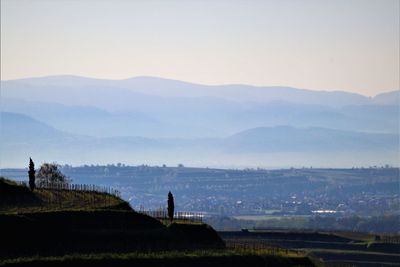 Scenic view of landscape and mountains against sky