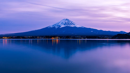 Scenic view of lake and mt fuji against sky during sunset