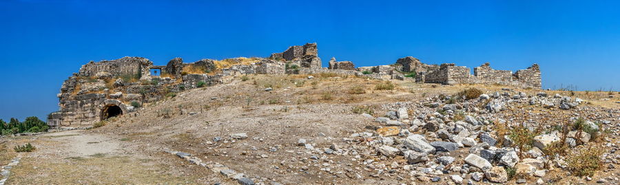 Old ruins against clear blue sky