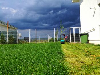 View of soccer field against cloudy sky