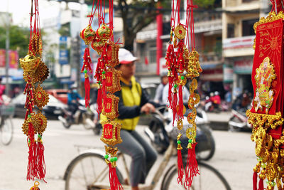 Decorations hanging by street for sale in city