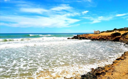 Scenic view of beach against sky