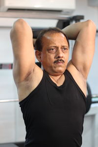 Determined man exercising in gym