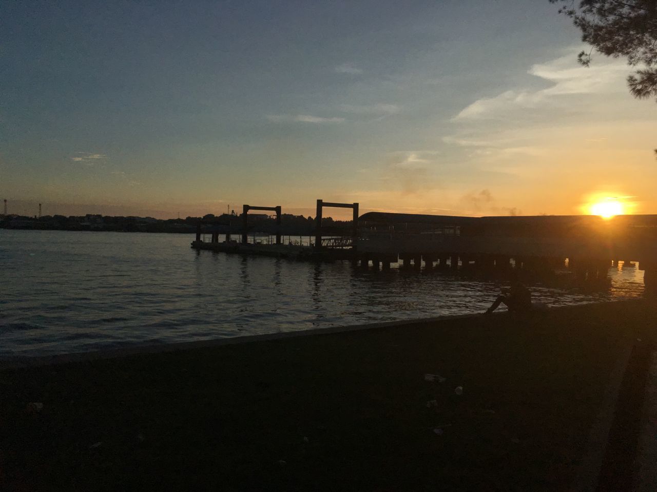 SILHOUETTE PIER ON SEA AGAINST SKY AT SUNSET