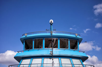 Low angle view of boat against blue sky