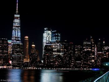 Illuminated city buildings at night