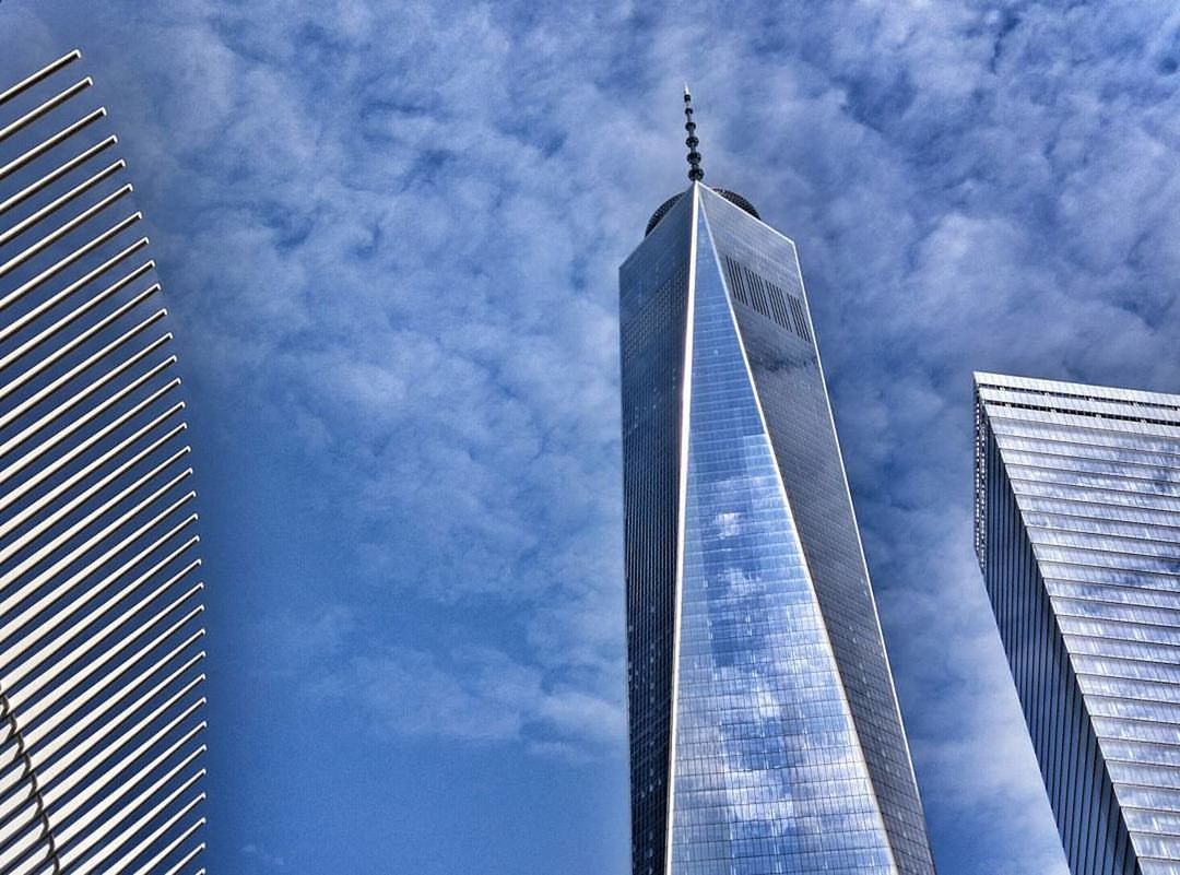 LOW ANGLE VIEW OF TOWER AGAINST CLOUDY SKY