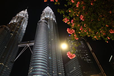 Low angle view of illuminated buildings at night