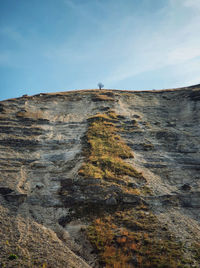 Idyllic countryside view to a bare and lone tree on the top of the karst limestone hills at orhei